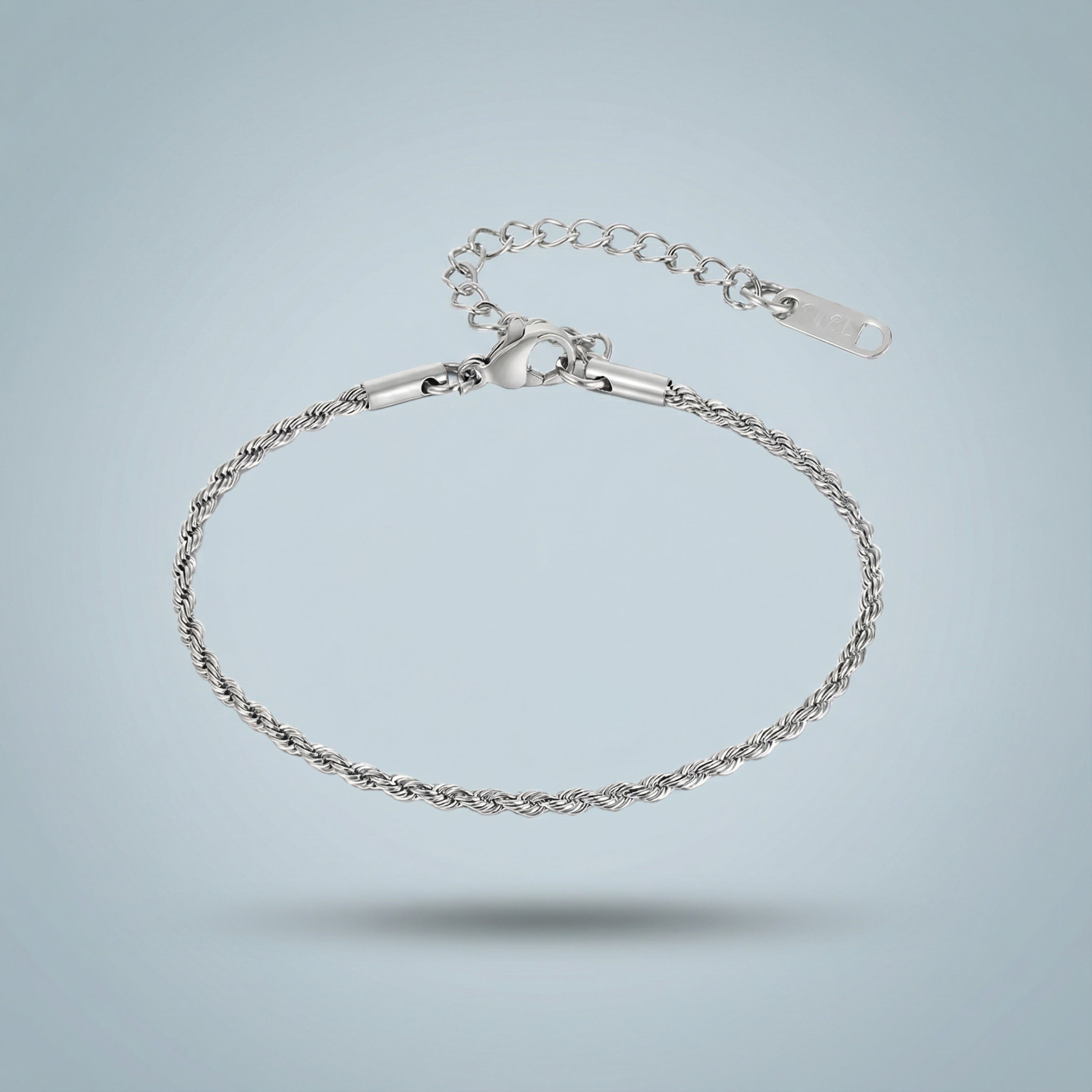 Silver bracelet on a light gray background