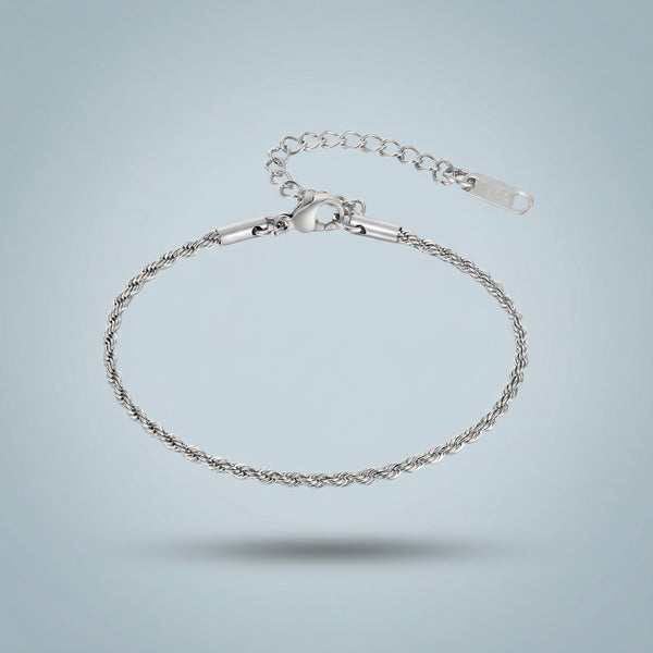 Silver bracelet on a light gray background