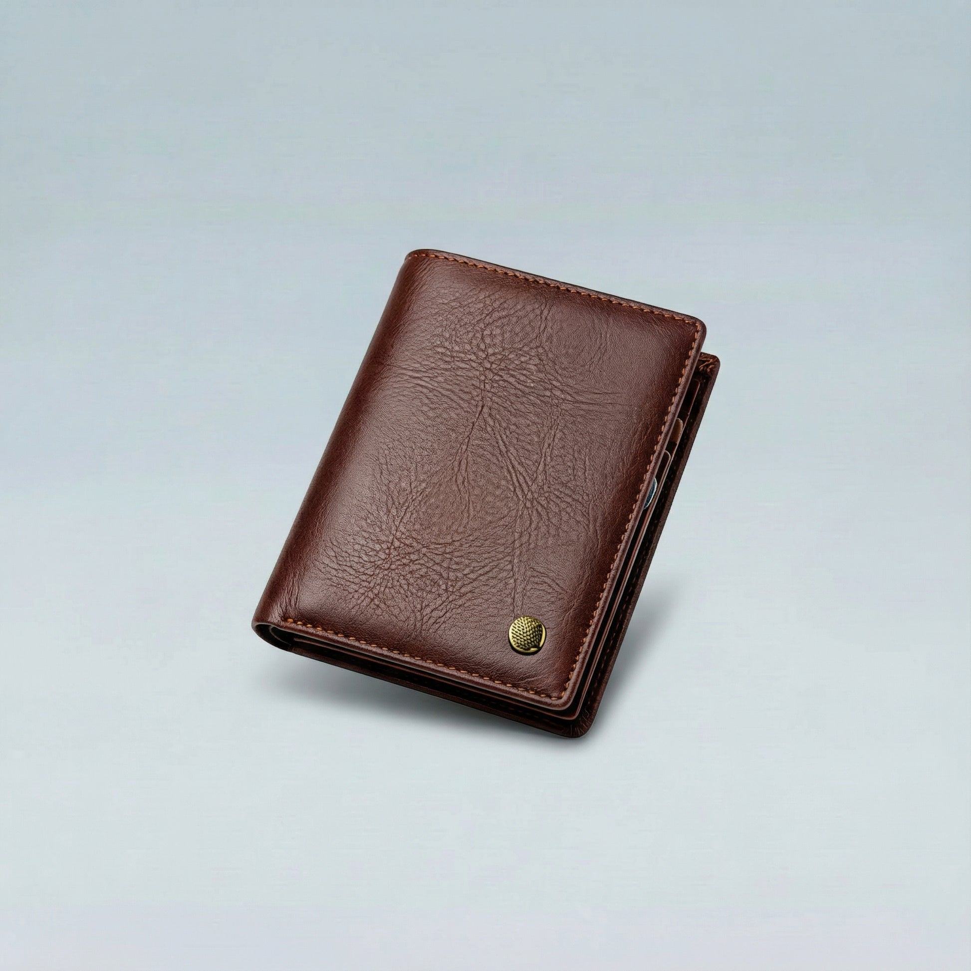 Brown leather wallet on a light gray background