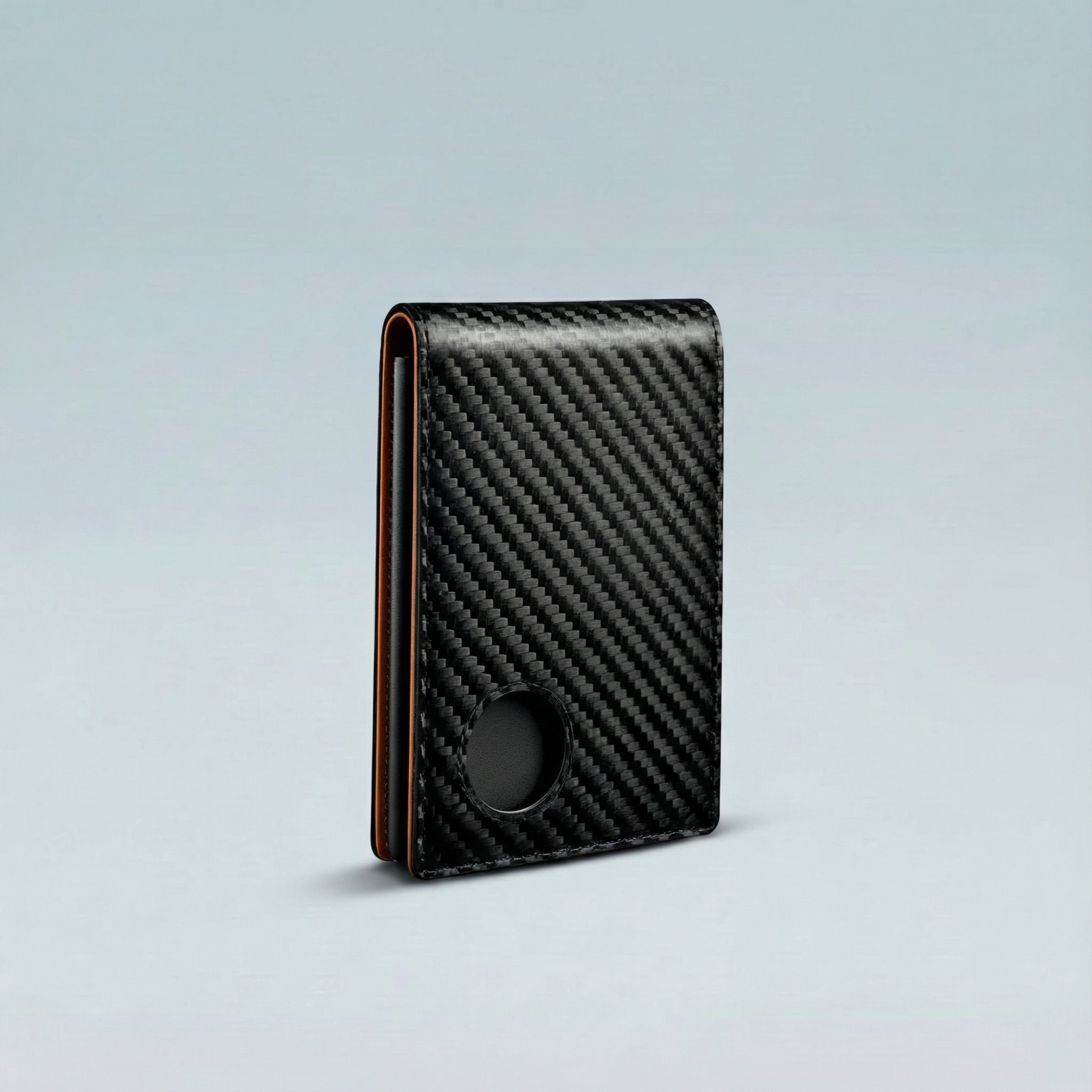 Carbon fiber patterned wallet on a light gray background