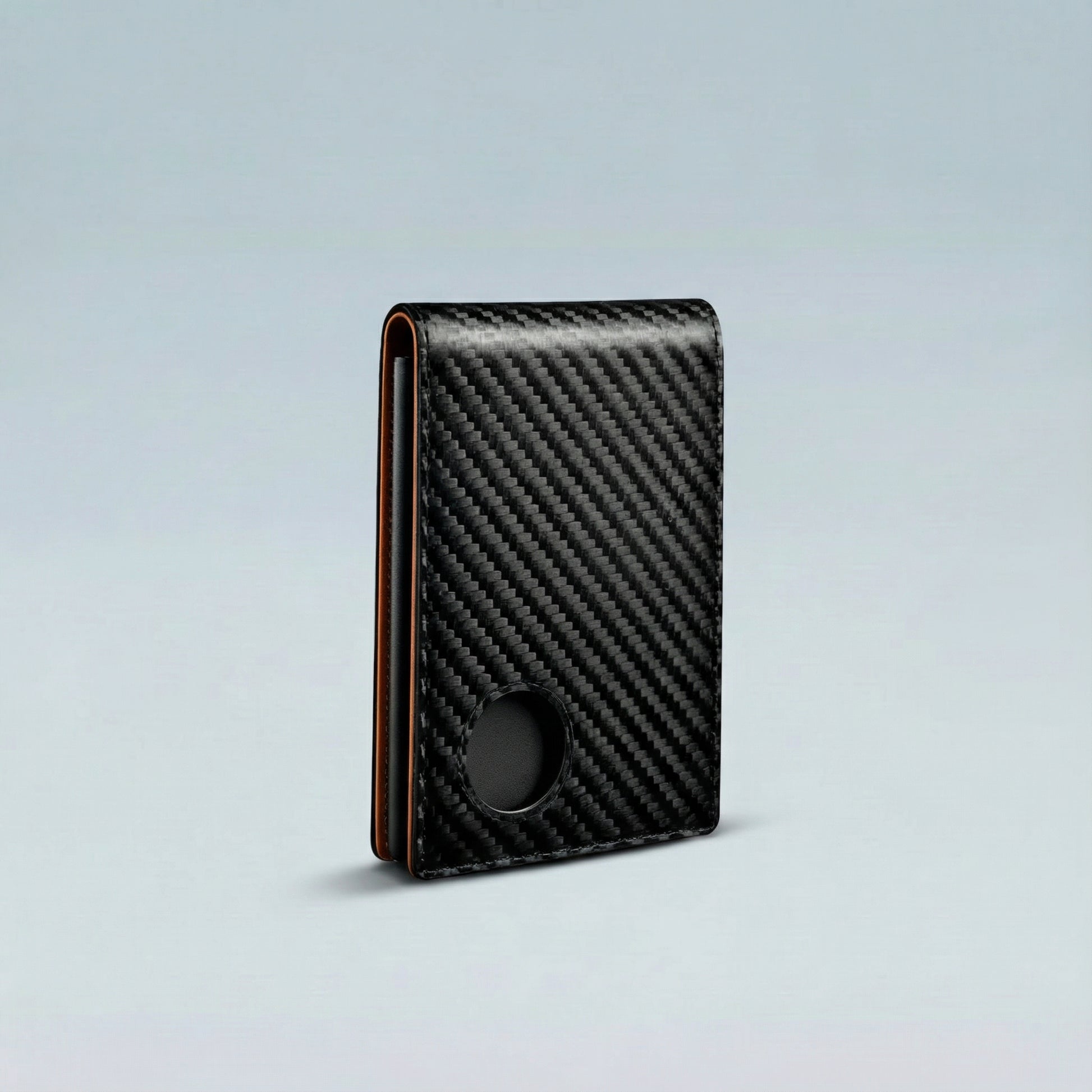 Carbon fiber patterned wallet on a light gray background